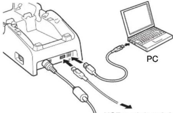 Diagram showing connections between a device and a laptop, labeled 'PC' with arrows indicating cable or connection points.