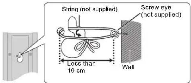 String (not supplied) Screw eye (not supplied) Less than 10 cm Wall