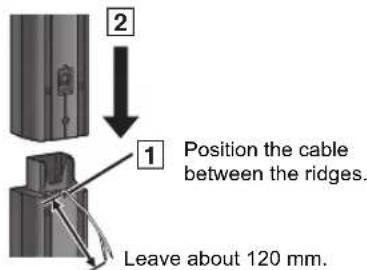 2 1 Position the cable between the ridges. Leave about 120 mm.