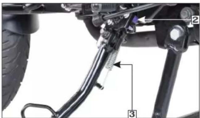 Technical diagram of a vehicle suspension system with labeled components and directional arrows indicating motion paths.