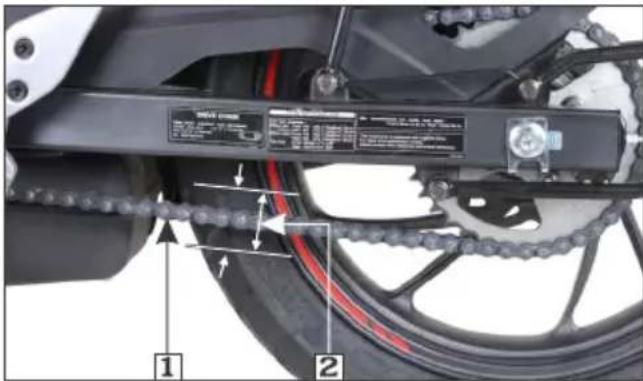 Technical diagram of a motorcycle's side chain and drivetrain with labeled components and parts