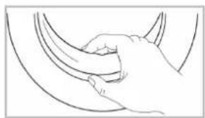 Line drawing of a hand gripping a curved object (no text or symbols)