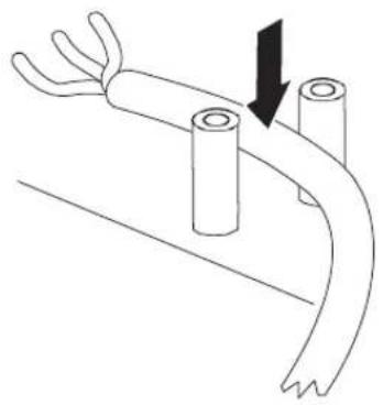 Diagram of a cable or wire being inserted into a terminal block, showing a black arrow indicating direction (no text or symbols present)
