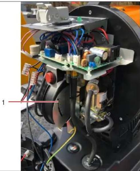 Interior view of an electronic device with visible circuit boards, capacitors, and wiring (no text or symbols)