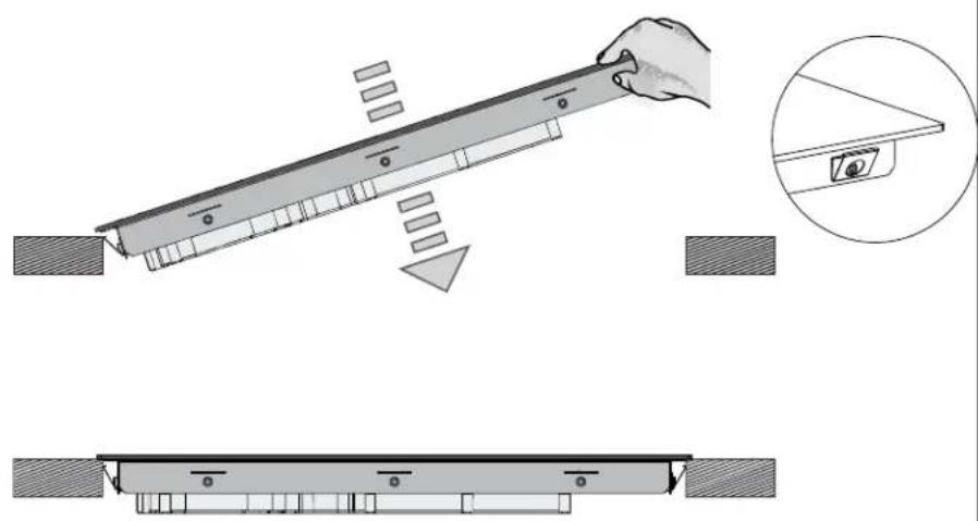 Technical illustration of a mechanical assembly with a hand operating a lever and a close-up view of a component (no text or symbols present)