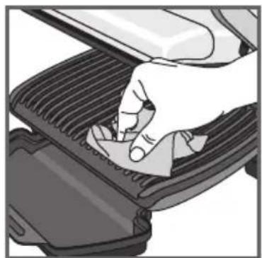 Illustration of a hand pressing down on a gridded mechanical component (no text or symbols visible)