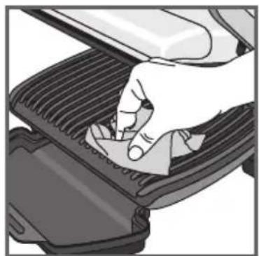 Illustration of a hand pressing down on a gridded metal component (no text or symbols visible)
