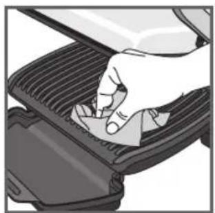 Illustration of a hand pressing down on a gridded metal component (no text or symbols visible)