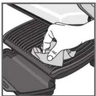 Hand pressing down on a car grille (no text or symbols visible)