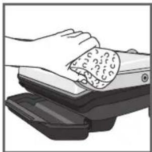 Illustration of hands cleaning a textured object from a mechanical device (no text or symbols visible)
