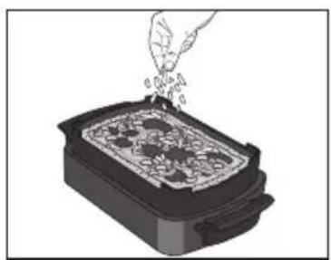 Illustration of a hand pouring granular material into a rectangular dish (no text or symbols visible)