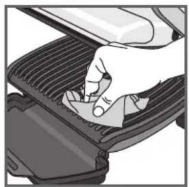 Hand pressing down on a mechanical component (no text or symbols visible)