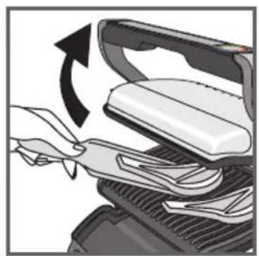 Close-up of a mechanical device with a hand adjusting a component, showing a curved arrow indicating rotation (no text or symbols present)