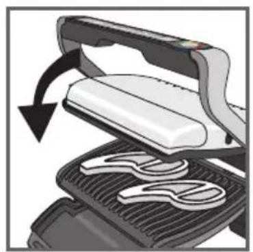 Illustration of a grater being cut with a black arrow indicating rotation (no text or symbols)