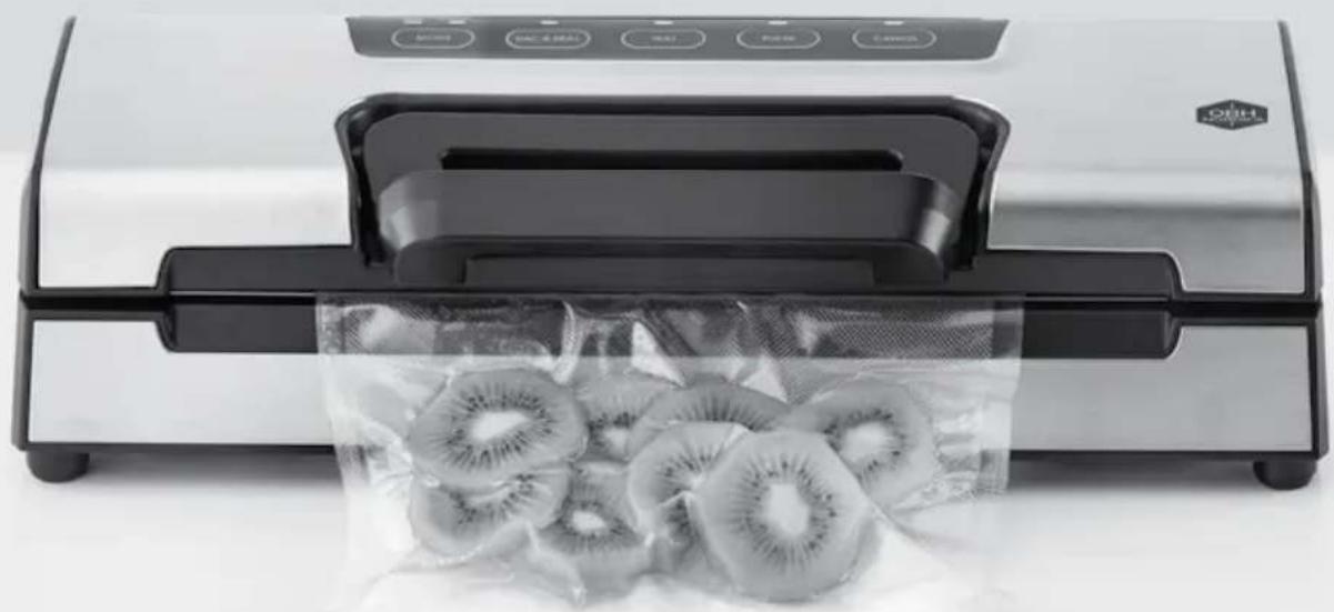 Exterior view of a modern kitchen or processing machine with a wrapped sheet of kiwiflava (no visible text or symbols)