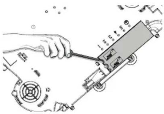 Technical diagram showing a hand using a tool to adjust or install a mechanical component with labeled parts and motion indicators.