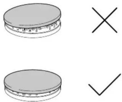 Diagram showing two circular objects with labels and a checkmark, possibly indicating selection or confirmation.