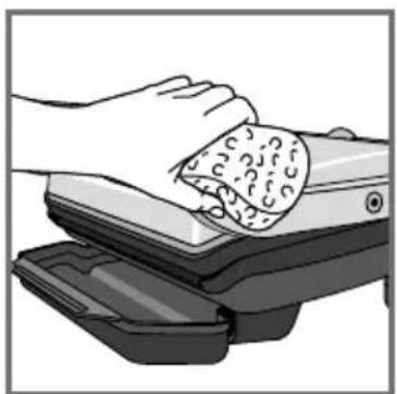 Illustration of hands cleaning a food item from a machine (no text or symbols visible)