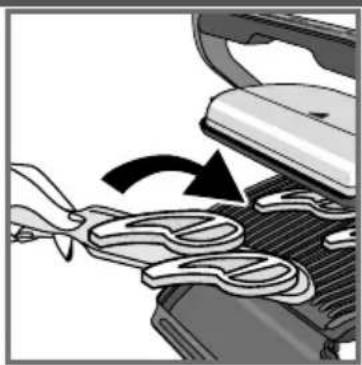 Close-up of a car interior showing a hand holding a tool near the engine compartment, with no visible text or symbols.