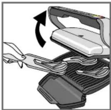 Illustration of a sewing machine with scissors and fabric being inserted (no text or symbols)