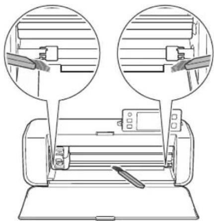 Line drawing of a printer with two circular insets showing the top view and side view of the printer's internal structure (no text or symbols)