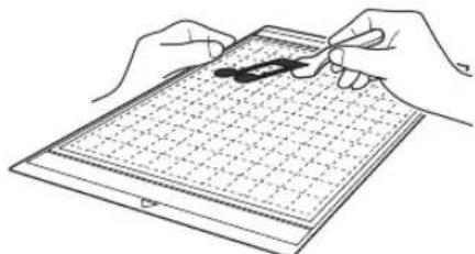 Line drawing of two hands holding a grid-based object with a pen, no text or symbols present