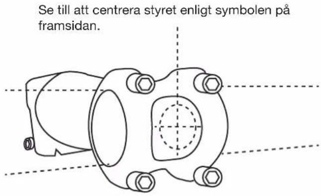 Se till att centrera styret enligt symbolen på framsidan.