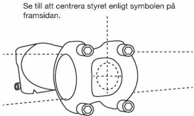 Se till att centrera styret enligt symbolen på framsidan.