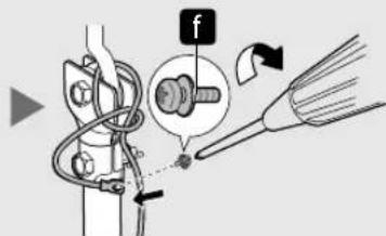 Diagram illustrating a mechanical assembly with labeled parts and directional arrows, including a magnified inset showing a bolt and tool.
