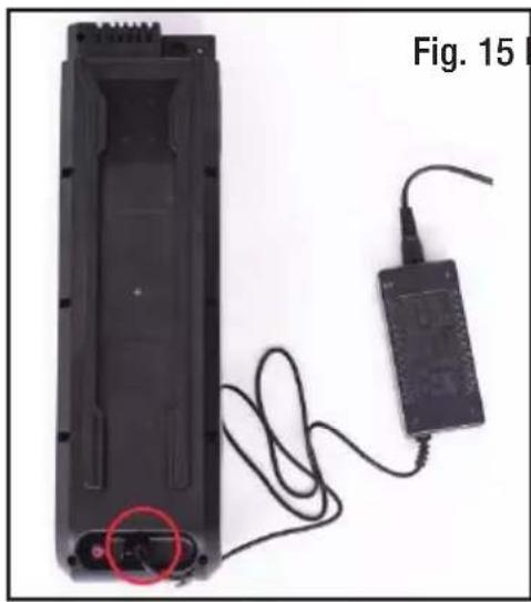 Black battery pack with attached cable and charger, labeled Fig. 15 (no text or symbols on main subject)