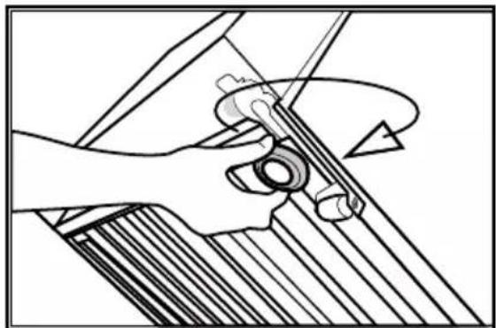 Mechanical diagram showing hands operating a tool with a circular component, no text or symbols present