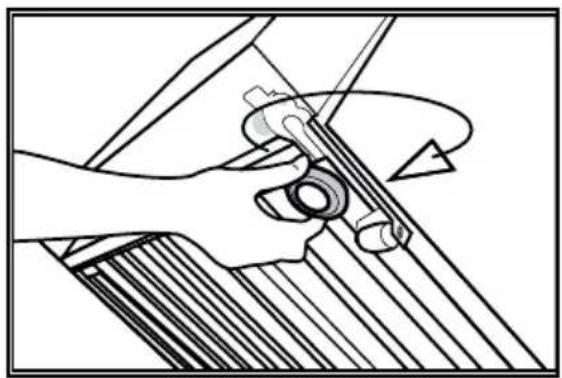 Mechanical assembly diagram showing a hand operating a tool with a circular component, no text or symbols present