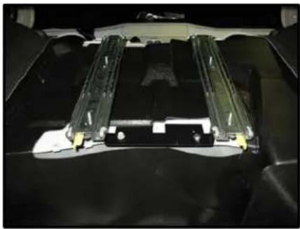 Interior view of a vehicle chassis with visible structural components and mounting brackets (no text or symbols)