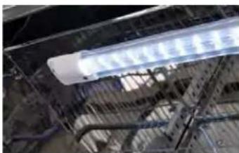 Interior view of a modern building with exposed steel beams and overhead lighting (no visible text or symbols)