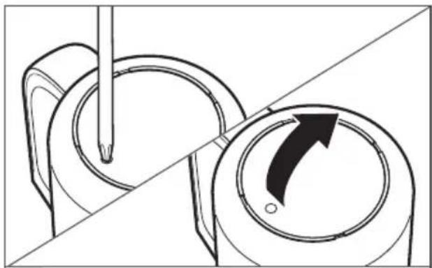 Diagram showing a tool interacting with a circular component, with an arrow indicating rotation (no text or symbols present)