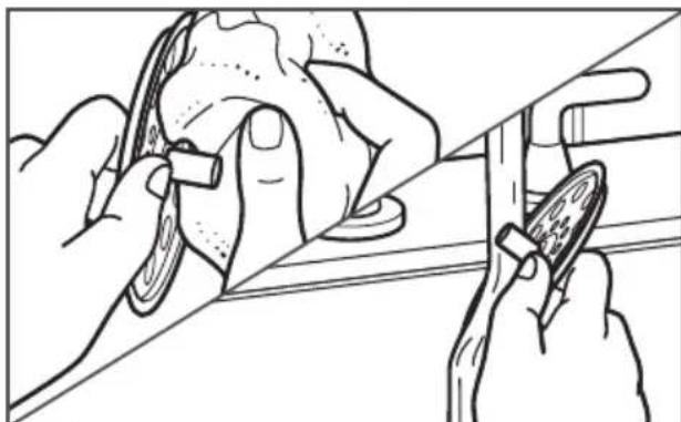 Line drawing of hands using a tool to adjust or install a mechanical component (no text or symbols present)