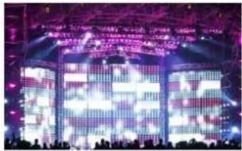 Stage photo of a music concert with large digital screens displaying Chinese text and audience silhouettes