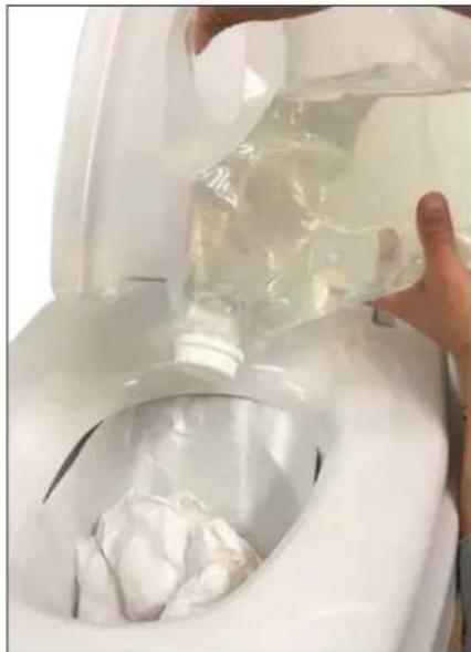 Close-up of hands pouring liquid into a white toilet with plastic bag (no text or symbols visible)