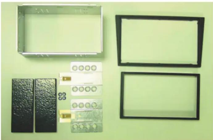 Exterior view of a plastic enclosure with metal components and two empty rectangular enclosures on a green background (no text or symbols)