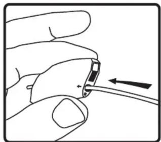Hand holding a small electronic component with a black arrow pointing to it (no text or symbols)
