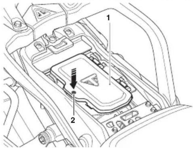 Technical diagram of a vehicle's internal components with numbered parts and directional arrows indicating assembly or inspection.