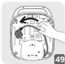 Illustration of a hand inserting a device into an open rear panel, showing internal components and a directional arrow (no text or symbols)