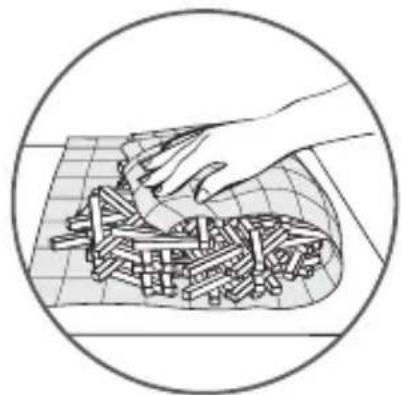 Illustration of a hand placing cylindrical objects onto a grid-patterned surface within a circular frame (no text or symbols)