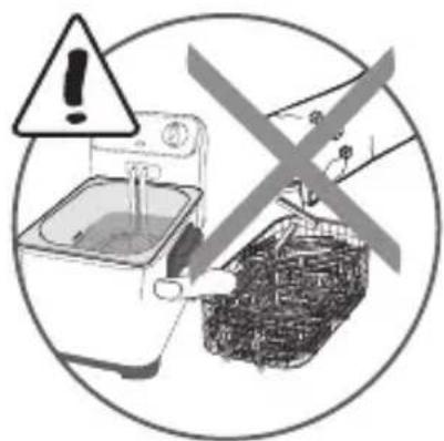 Warning symbol and instruction illustration showing a washing machine and a basket with a warning sign