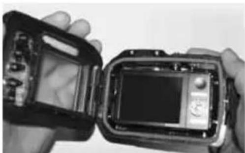 Close-up of hands holding a device with visible internal components (no text or symbols)