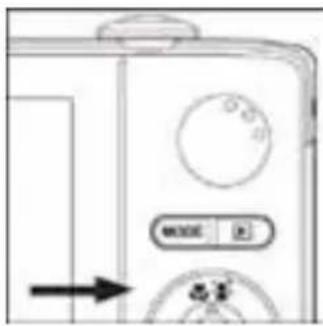 Close-up of a device front panel with buttons and a directional arrow (no readable text or symbols)