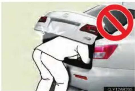 Street photo showing a person in white suit pushing a car with a red prohibition symbol overlay