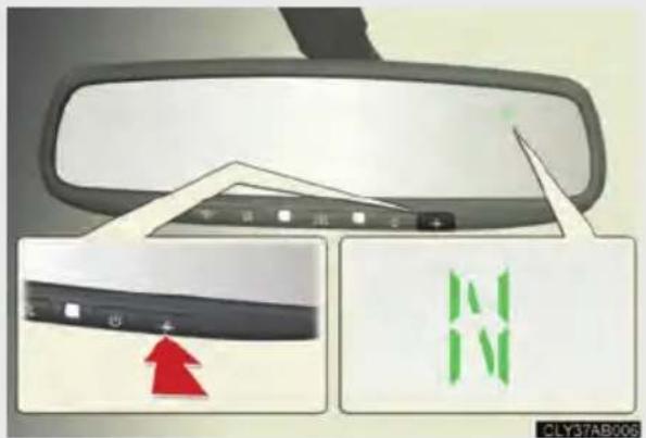 Diagram showing car rearview mirror with a red arrow pointing to the left panel and a green 'N' symbol inside, labeled CLY37AB2006.