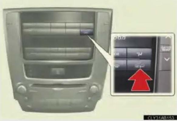 Car infotainment panel with Chinese UI, showing control buttons and a red upward arrow indicating action