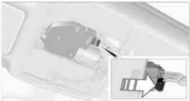 Close-up of a mechanical component with a magnified inset showing a close-up of a connector (no visible text or symbols)